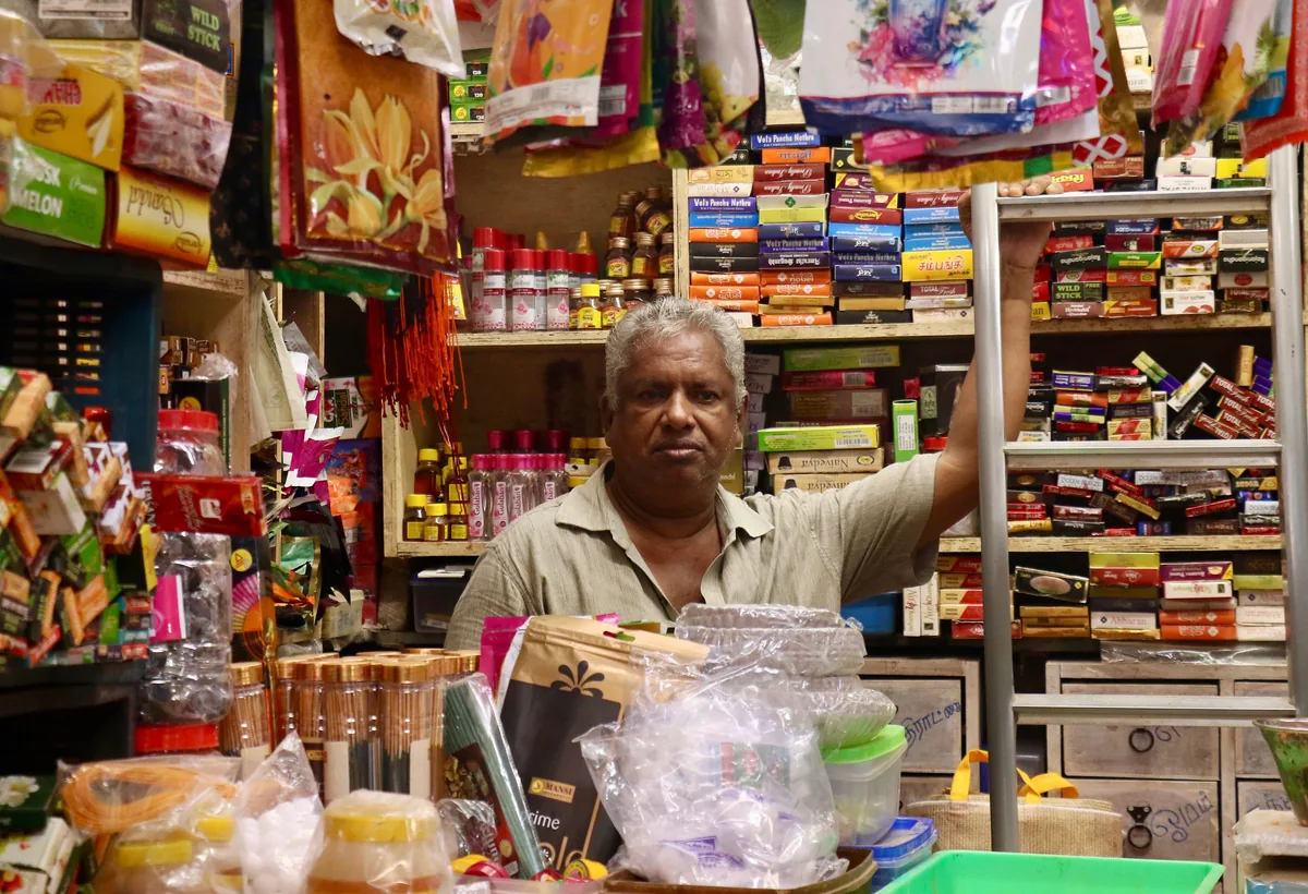 Retail shop owner managing daily business